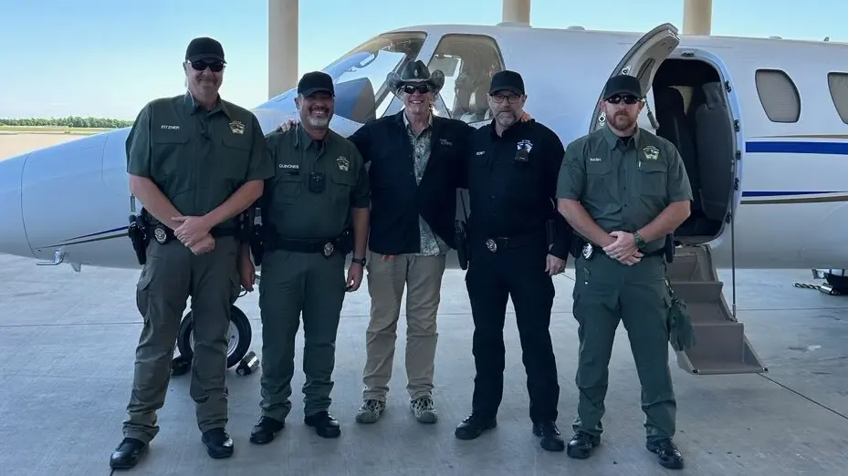 Officers Brady Fitzner, Supervisor Hector Quinones, Ted Nugent, Lt. Cmdr. Michael Richey, and Officer Gregory Nash